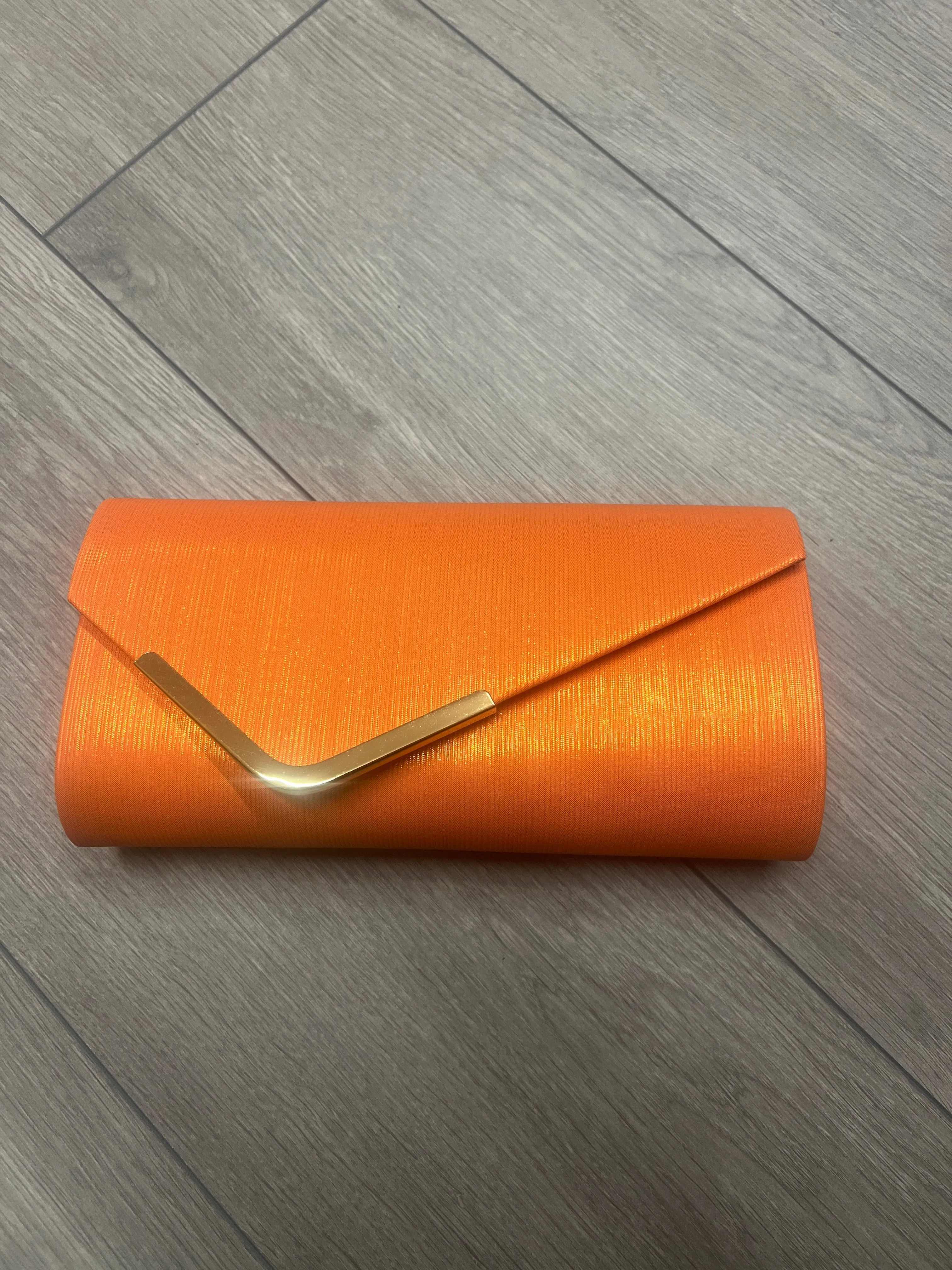 Metallic Clutch Bag With Gold Trim- Orange